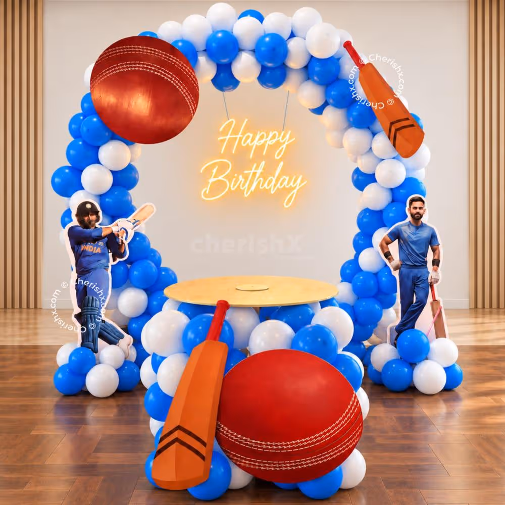 Cricket Lover Ring Stand Birthday Decor with a blue and white balloon arch, cricket bat and ball cutouts and a Happy Birthday neon light.