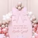 Pink ribbon sunboard cutout next to the Welcome Baby Vintage Blush Balloon Decoration.