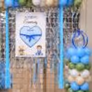 Custom name reveal board with stylish pastel balloon decor