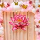 Pink floral balloon setup with golden butterfly details