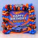 Hot Wheels Power Squad Birthday Decoration With Customized 6x6 Feet Racing Background And Balloon Arch.