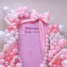 Elegant satin bow décor for an unforgettable Welcome Baby celebration.
