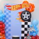 Race day birthday backdrop with silver star foil balloons