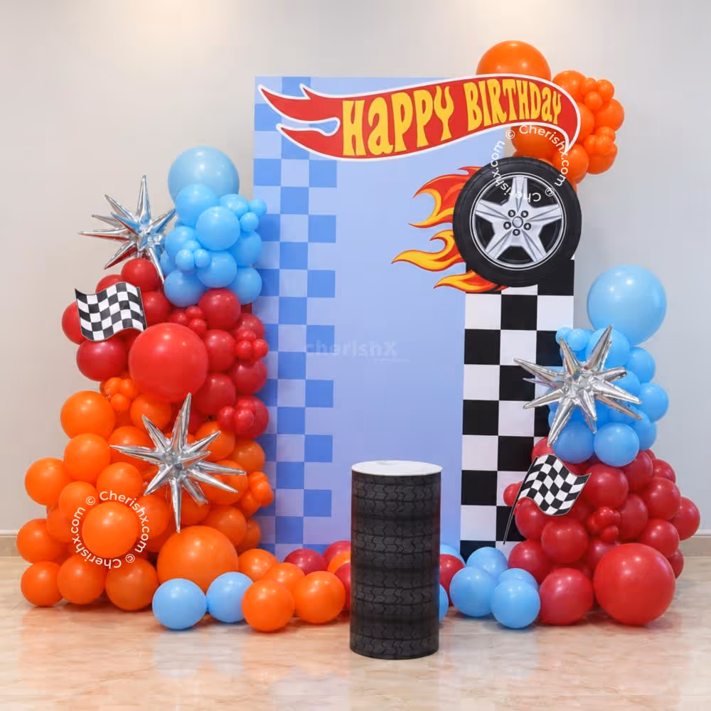 Fun racing theme celebration with floating balloons and flags