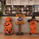 Halloween counter decor with spider web and hanging ghost decorations