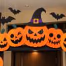 Halloween doorway decoration with A3 pumpkin paper cutouts, freestanding entrance arch and spooky ceiling bats, professionally arranged by CherishX