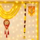 Simple Diwali Reception Desk Decoration with Yellow Flowers and LED Candles.
