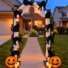 Spooky Black Cat Halloween Entrance Decoration with pumpkin lanterns, LED candles and white net arch setup by CherishX.