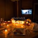 Romantic Karwa Chauth private dining room with personalised OTT entertainment.