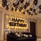 Elegant Birthday Setup with Black Foil Letter Balloons