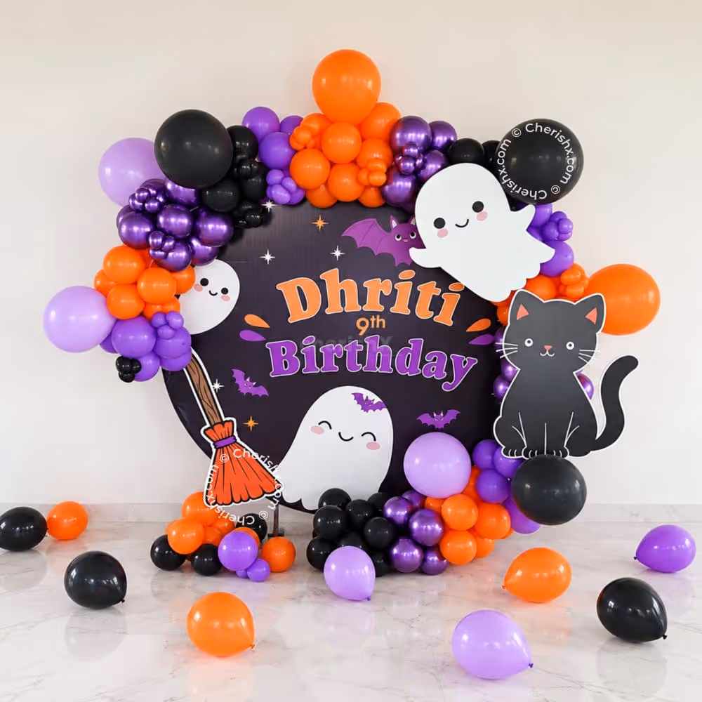 Metallic and purple chrome balloons add a striking Halloween touch.