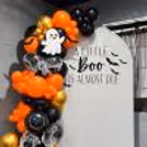 Bring on the boos with orange, black and golden balloons, spooky cutouts and a customized Halloween backdrop!