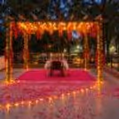 Romantic pergola candlelight dinner at Hamoni Gurgaon with golf course views.