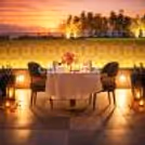 Elegant lower deck romantic dinner setup beside the pool at Holiday Inn Gurgaon.