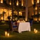 Intimate garden candlelight dining experience at The Grand, Vasant Kunj, beautifully arranged for a special Karwa Chauth celebration.