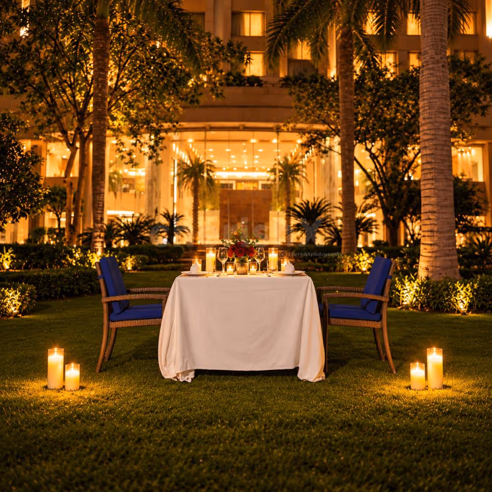 Romantic Karwa Chauth garden candlelight dinner at The Grand, Vasant Kunj, New Delhi, featuring an elegant outdoor dining setup.