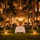 Luxury open-air Karwa Chauth dinner for couples at The Grand Delhi with beautiful candlelight décor and a romantic garden ambience.