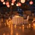 Beautiful open-air candlelight dining experience with pink lanterns and floral décor at Hyatt Centric