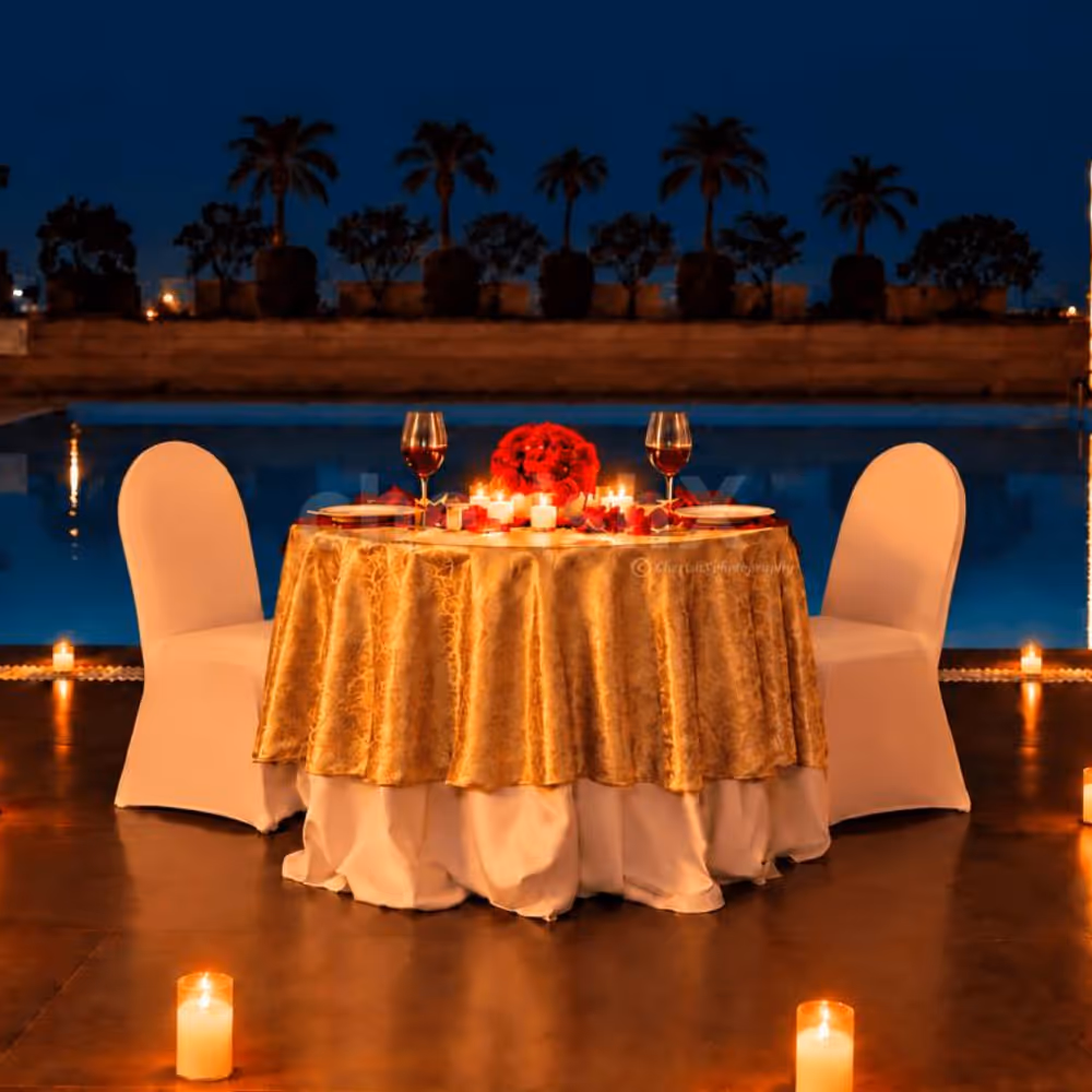Romantic poolside candlelight dinner at Hyatt Centric Gurgaon with elegant table décor and beautiful evening ambience.