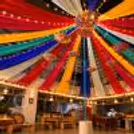 Vibrant ceiling decor with colourful drapes and lights