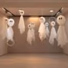 Small Halloween ghosts with flowing white net fabric