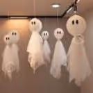 Big ghost decorations with paper eyes and white net fabric