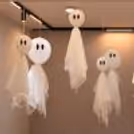 Spooky white ghost decorations for Halloween celebrations