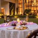 Romantic poolside candlelight dinner setup for couples at Eros Hotels, South Delhi