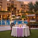 Luxury private poolside dining experience with elegant table décor and candlelight in South Delhi.