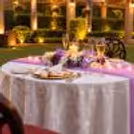Couple enjoying a luxury poolside candlelight dinner with romantic décor, perfect for anniversaries and date nights in Delhi.