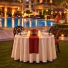 Private poolside dinner date featuring candlelight, decorative table settings, and a peaceful ambience in South Delhi.