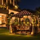 Romantic gazebo dining experience in South Delhi featuring a private table for two and beautiful decorative arrangements.