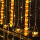 Warm LED Strings Balcony Lighting in a festive arrangement against a black rail.