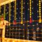 Hanging Yellow Garlands and Pink Wool Tassels are used for Balcony Diwali Lighting.