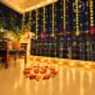 Designer Diwali rangoli decoration with LED candles for a festive balcony