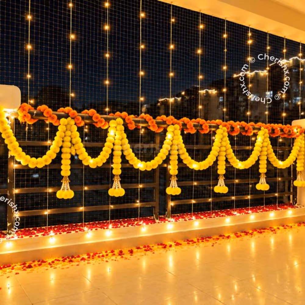 A Diwali Balcony Decoration including Marigold Garlands and Warm Fairy Lights.