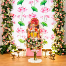 Fresh white flower petals spread across the decor highlight purity of the puja