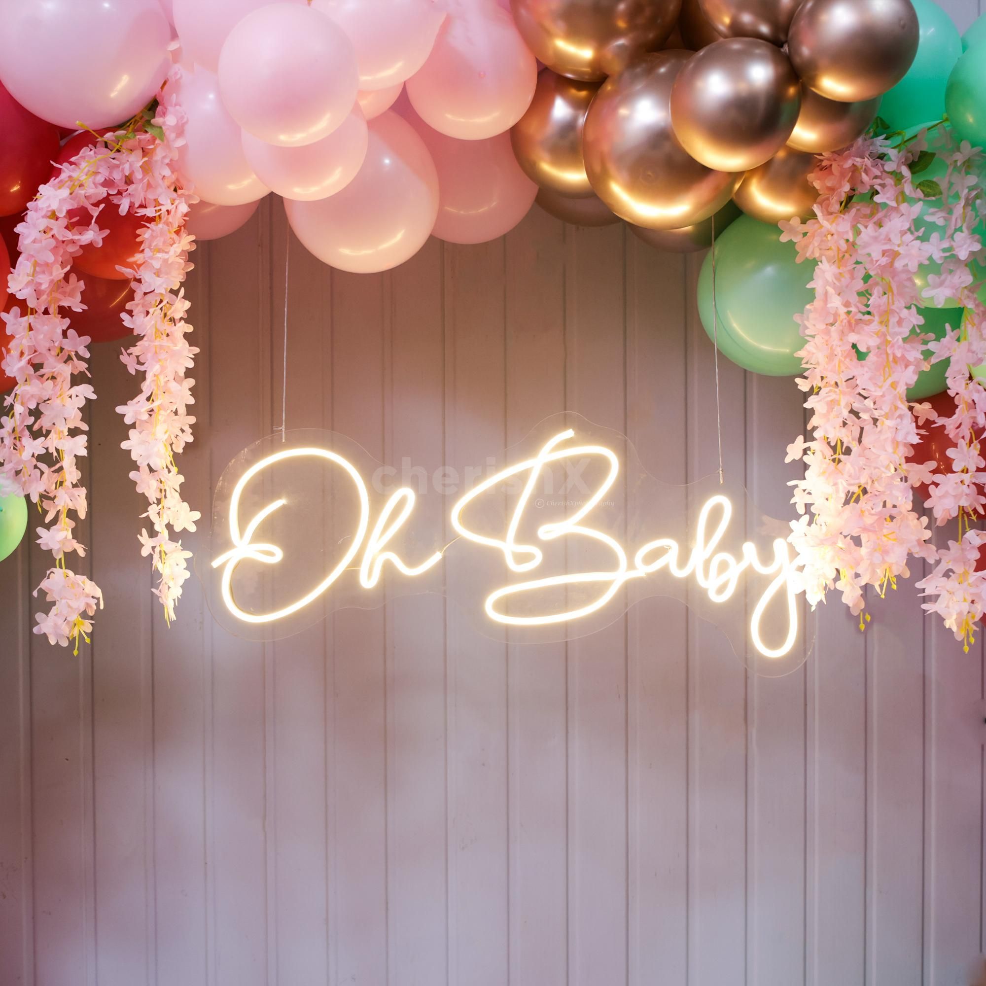 Soft pinks and greens craft a baby shower full of warmth and wonder