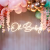 Soft pinks and greens craft a baby shower full of warmth and wonder