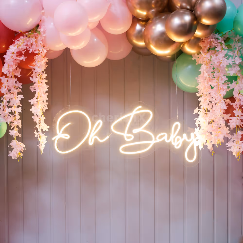 Soft pinks and greens craft a baby shower full of warmth and wonder
