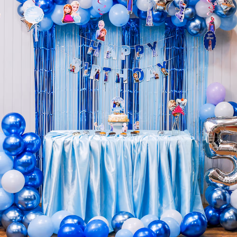Shimmering foil stars and bunting enhance the frozen birthday bash decor