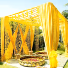 Twin urli bowls are placed centrally for haldi or mehendi rituals.