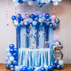 Frozen-themed balloon arch with bunting and toppers steals the party show