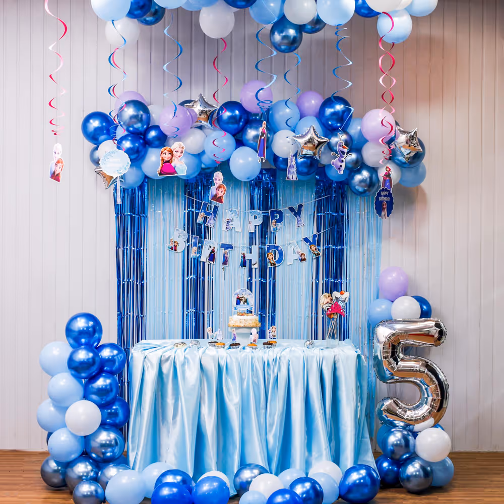 Frozen-themed balloon arch with bunting and toppers steals the party show