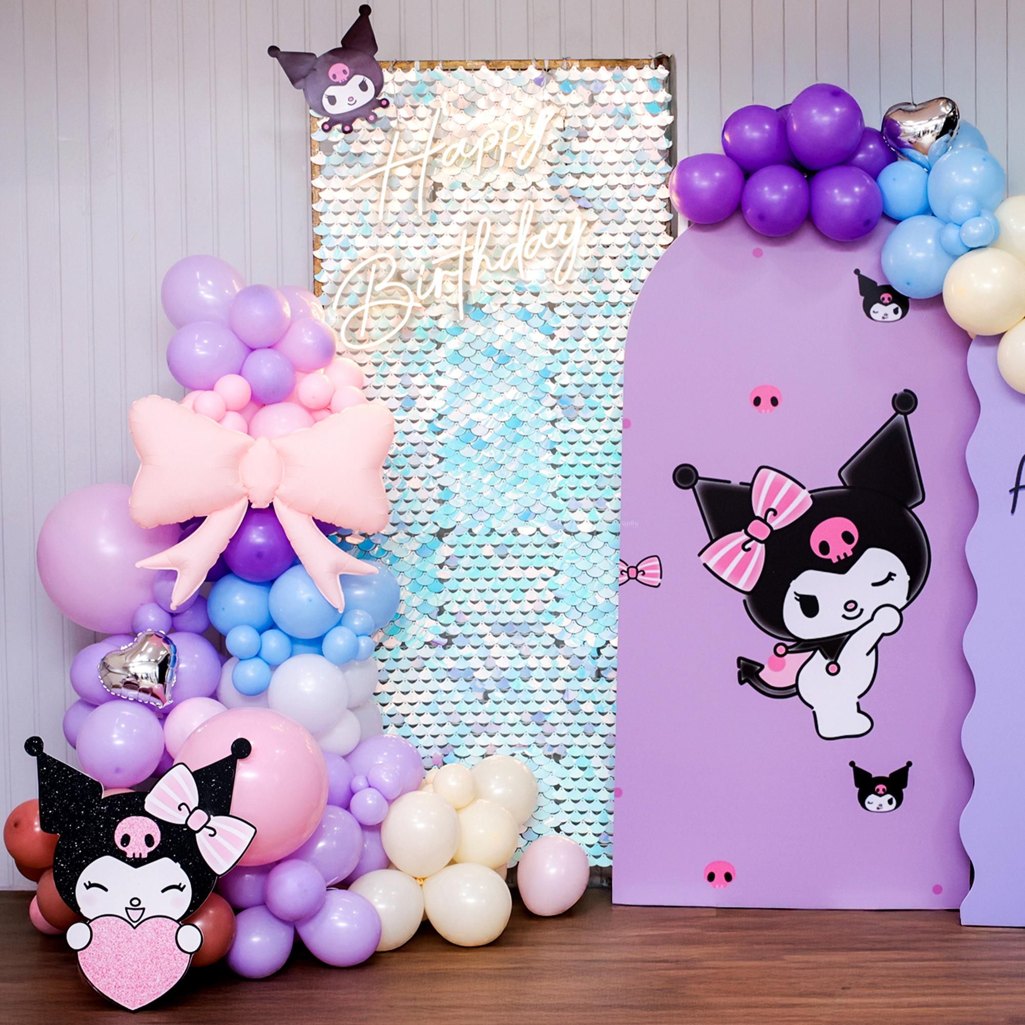 A pastel balloon arch spreads fun colors around the party.