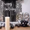 A perfectly eye-pleasing birthday cursive foil balloon on a frill curtain