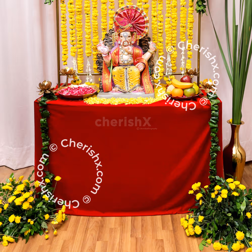 To give the puja spot a creative glow, add the iron stand and drape fairy lights in the backdrop.