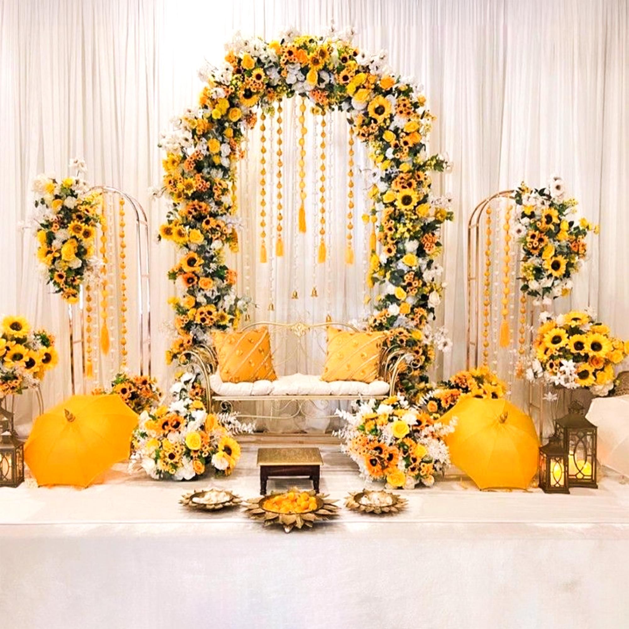 A sunny sunflower arch raining golden joy upon the setup.