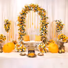 A sunny sunflower arch raining golden joy upon the setup.