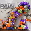 Make Halloween photos fun with a bright balloon and foil backdrop.